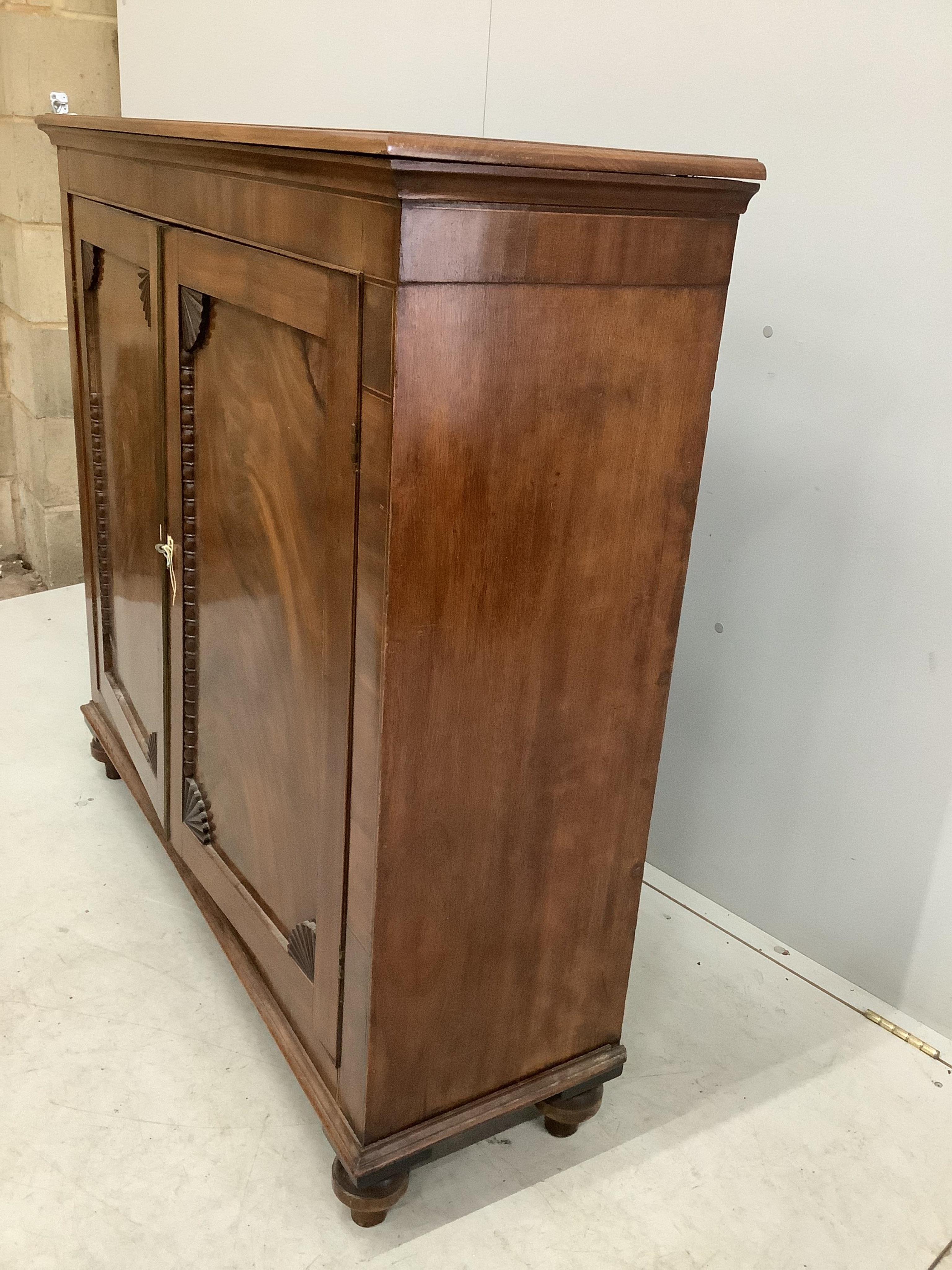 An early Victorian mahogany side cabinet, with bone escutcheons, width 118cm, depth 36cm, height 111cm. Condition - poor to fair